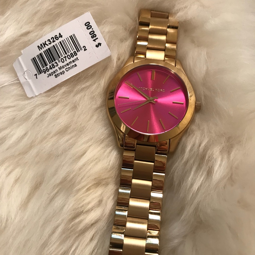 Gold Michael Kors watch with pink dial
